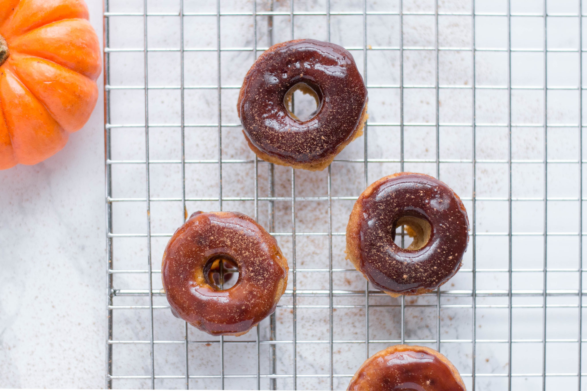 Paleo Maple Glazed Pumpkin Spice Doughnuts