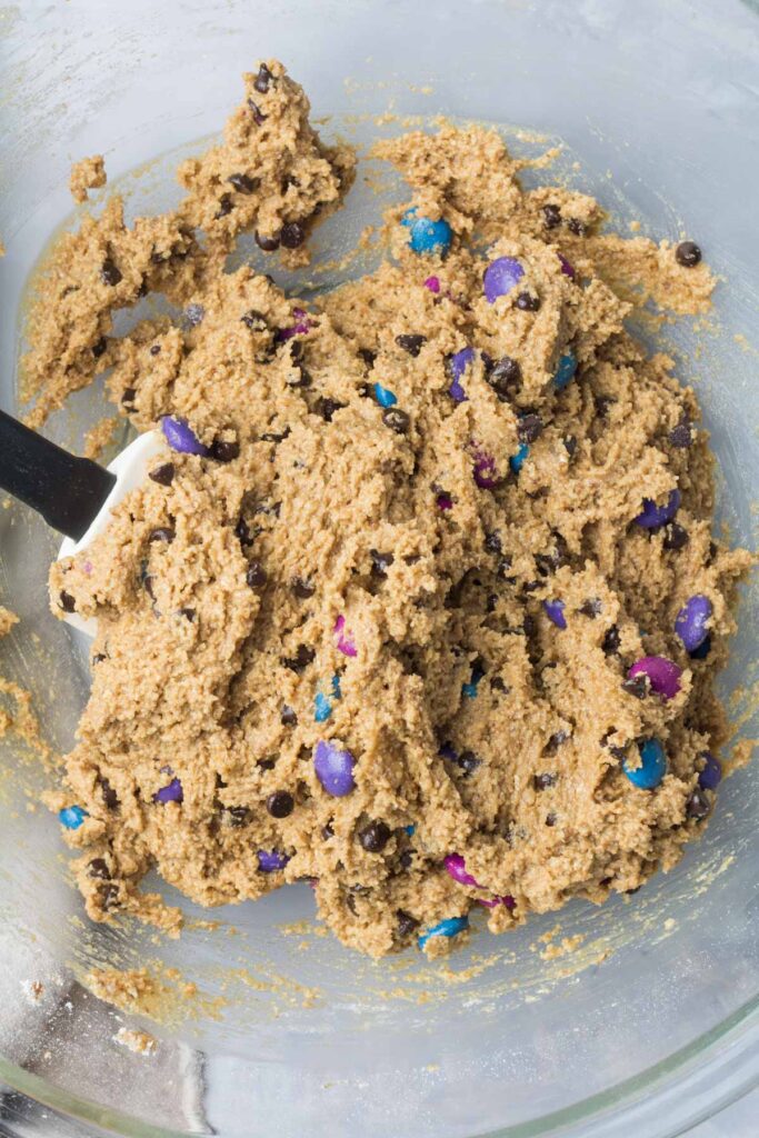 top down view of gluten-free monster cookie dough in a mixing bowl