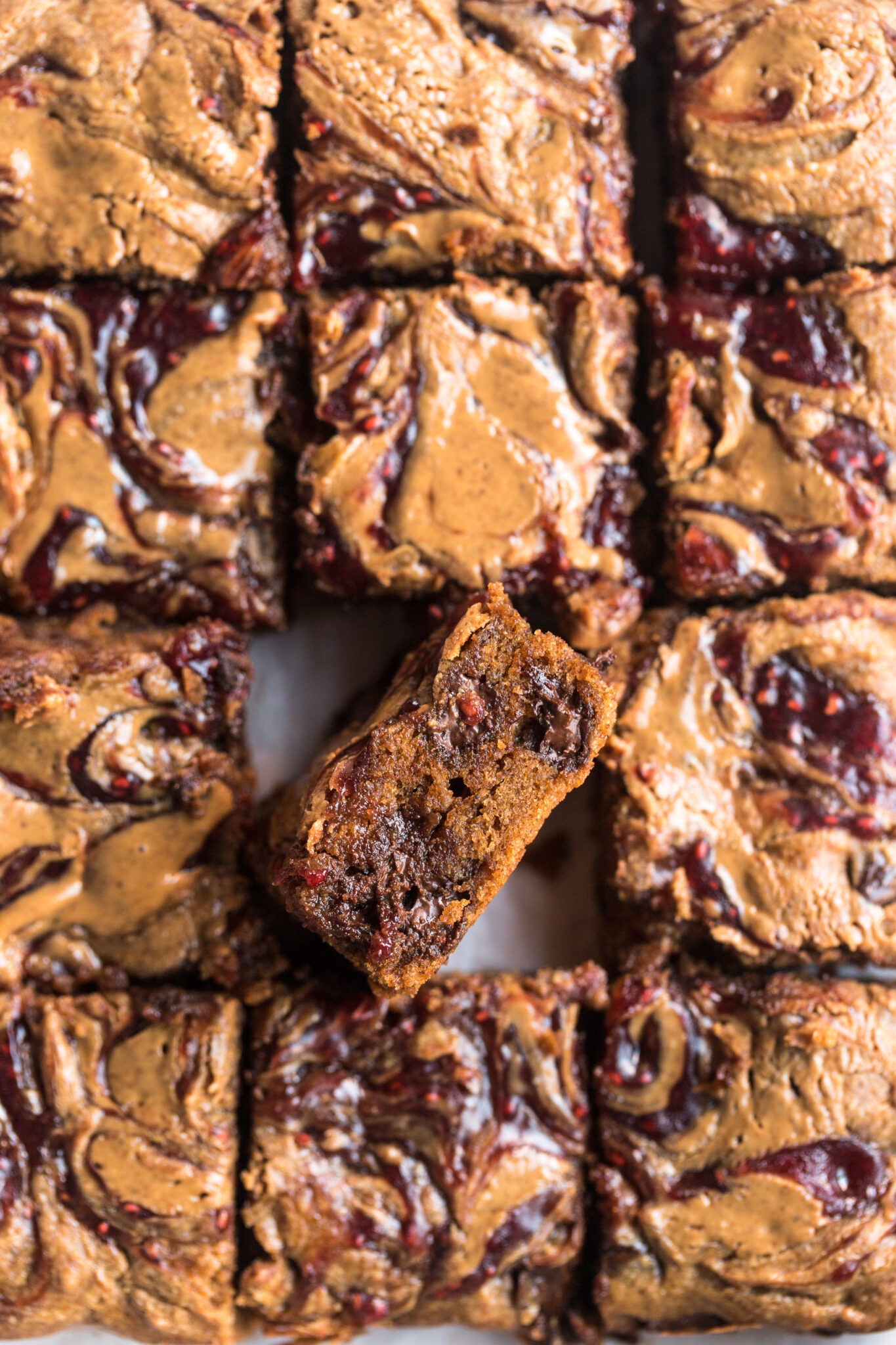 top down view of baked raspberry almond flour blondies cut into squares