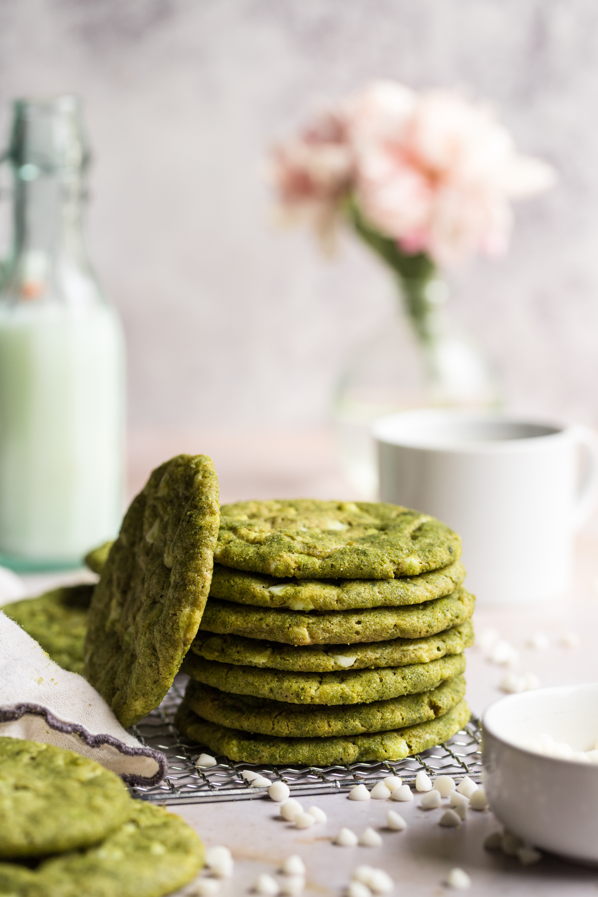 side view of stacked matcha cookies on a wire rack