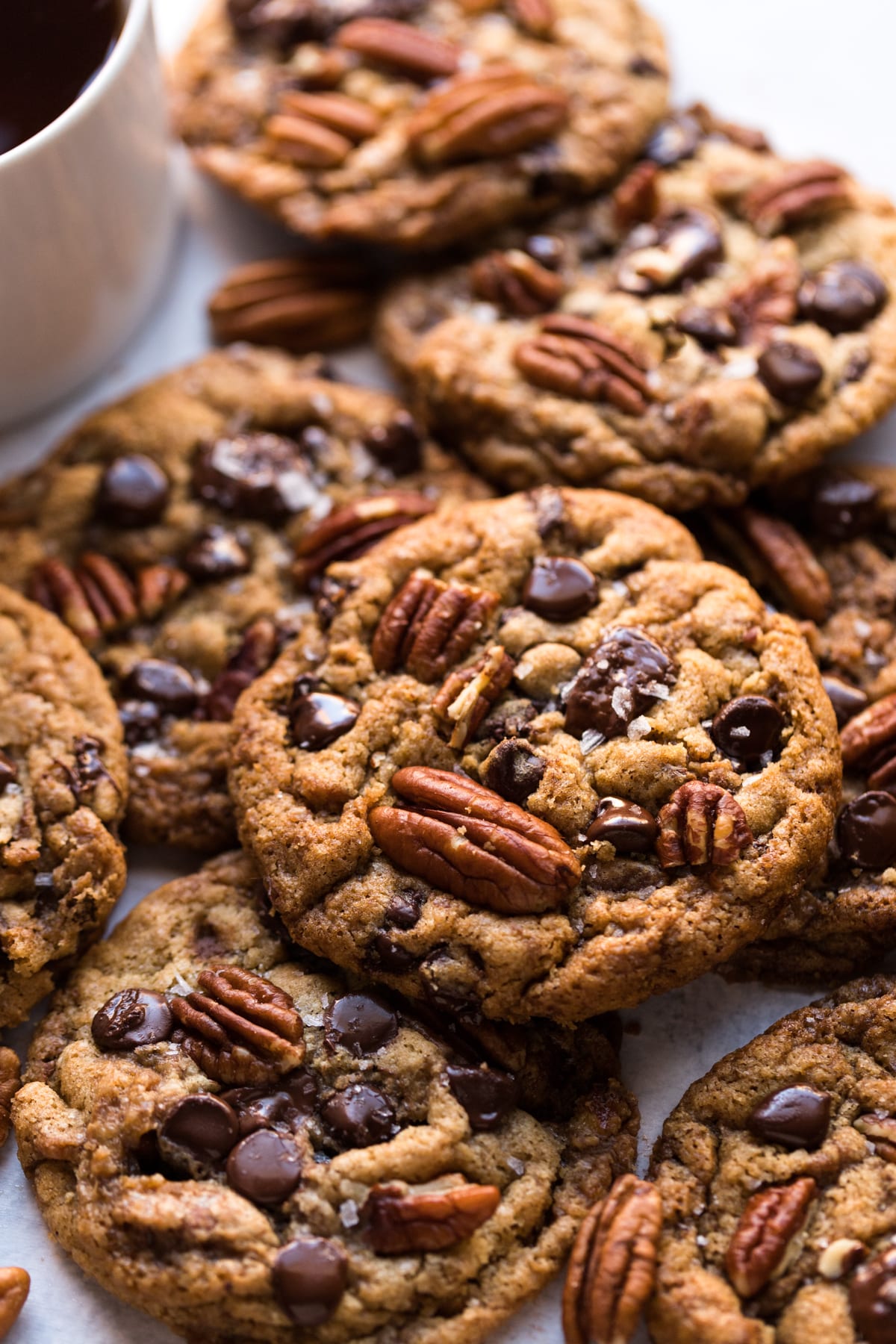 close up batch of pecan chocolate chip cookies